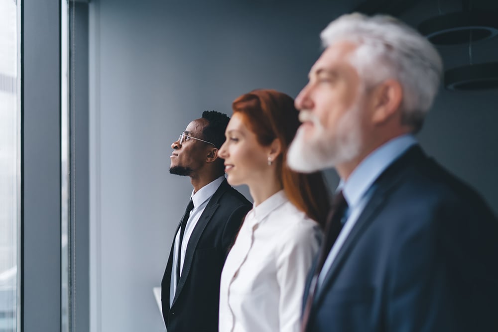 group-of-diverse-colleagues-standing-in-office-2026-01-09-07-55-21-utc